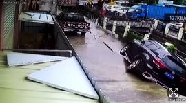 Car falls into river as road under it collapses in southern China