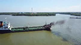 Oil tanker explosion kills one and injures four others on river in Thailand