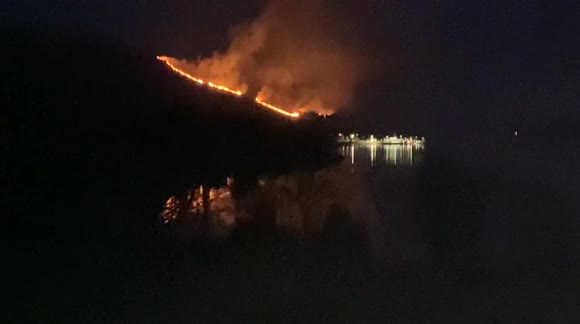 Burn on Scottish hillside lights up night sky
