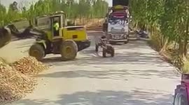 Driver narrowly escapes being crushed by reversing digger