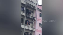 Heart-stopping moment kids play on thrid-floor balcony without railings