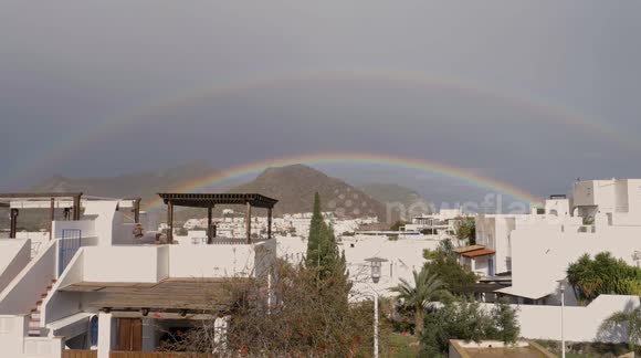 'Like something from Encanto!' Stunning double rainbow brightens skies above southern Spain