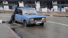 Car full of bullet holes spotted at Kyiv intersection in Ukraine