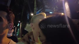 Police hunt woman seen stealing tourist's gold chain from under his nose during selfie video