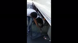 Truck driver found two migrants hiden in his truck, near Paris, France.