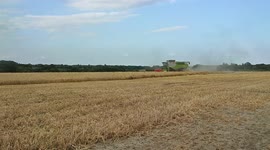 Combine Harvester harvesting a field of corn in North Yorkshire England