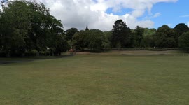 Green open space summer in Roberts Park Saltaire West Yorkshire UK