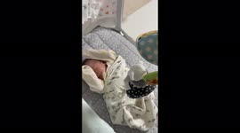 Cute baby sleeping under mobile