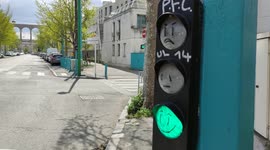 Smileys on red traffic lights in Paris suburb. Arcueil, avenue François Vincent Raspail. 2 april 2022