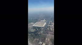 Futuristic Buddhist HQ seen from planes on approach to Bangkok airport