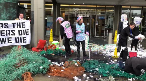 Ocean Rebellion activists drop 'plastic pellets' outside International Maritime Organization HQ in London