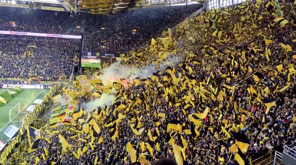 What does an audience for a full stadium not give a full house after 2 years. Football fans after corona measures in football stadium.