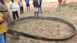 Villagers inspect objects that 'fell out of sky' in central India