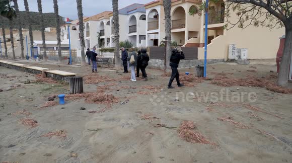 Huge waves strew sand and seaweed across Spanish town after meteotsunami warning