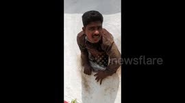 Bungling thief suffers from karma as he gets stuck in hole he drilled into temple