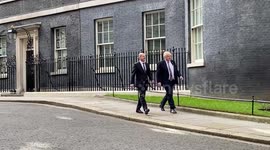 UK PM Boris Johnson and ,German Chancellor Olaf Scholz leave 10 Downing Street ahead of joint press conference