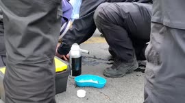 Police try to unglue Extinction Rebellion Protester