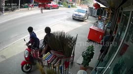 Truck topples over while going round corner and crashes into shop