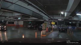 WTF MOMENT: Truck forced it's way through parking barrier as it couldn't fit (Dashcam Video)