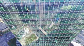 Fascinating drone shows nervy views for high-rise maintenance workers in China