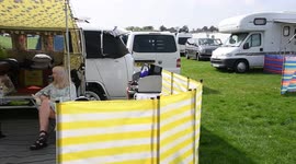 Campers drinking in the Bank Holiday sunshine at Chester Racecourse CamperFest