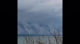Stunning storm front moves across Lake Michigan as late winter storms sweep across northern US states.