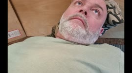 Baby monitor lizard cuddles up with her owner