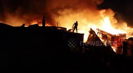 Fire rages through shanty town outside Cape Town, South Africa