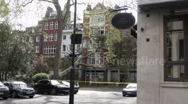 Large tree collapses onto buildings in Soho