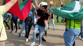 Protestors hitting the export minister banner with shoes to protect Pakistan, London, UK