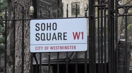 Work begins to remove tree which fell on a building in Soho Square