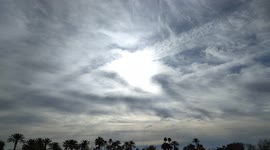 Sun forming an Eye in the Sky Piercing through Gloomy Clouds