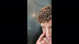 The cat wants to join the owner in the shower