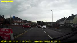 Mercedes goes through on red light for side road traffic seconds before it changes to green