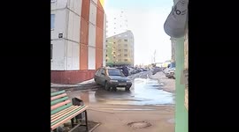 The man jumped into the neighbor's car, but got stuck in the window and nearly injured himself