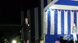 Student quickly falls off stage during college pageant in India