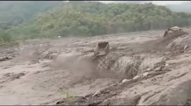 Mining trucks swept away during Indonesian lava flood