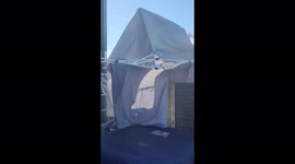 The gazebo over our hot tub jumped over the fence!