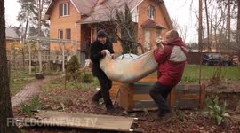 Son finally able to lay his mother to rest after Russian occupation forced him to bury her in his back yard in Irpin
