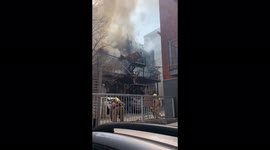 Firefighters in Montreal with a huge building in fife