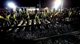 Hundreds of employees work through the night to connect railways in China
