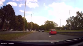 DASHCAM - Maniac impatient driver undertakes and weaves in and out of traffic to get ahead.