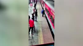 Man slips boarding moving train, saved by cop in western India