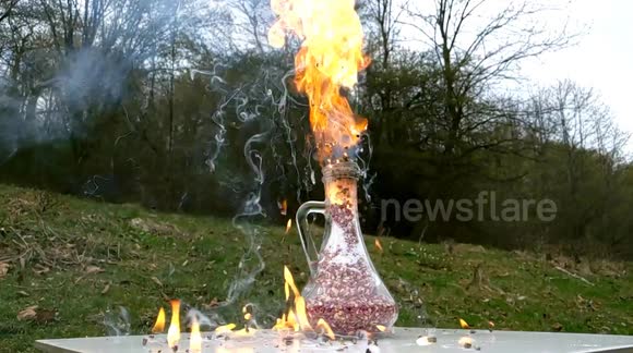 This is what happens when hundreds of match heads are lit inside a glass