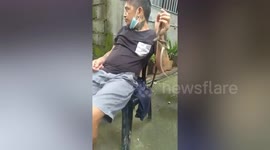 Man tries to kiss pet snake and is bitten by it