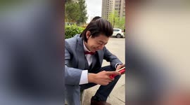 Groom watches his own wedding ceremony outside hotel while waiting for COVID-19 test result