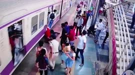 Police officer saves passenger who slips when boarding moving train in western India