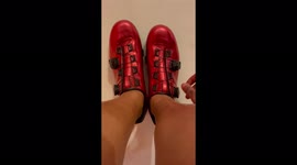 ASMR shiny red bicycle shoes being tightened up