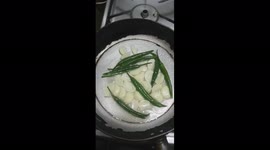 Cooking green chili and garlic