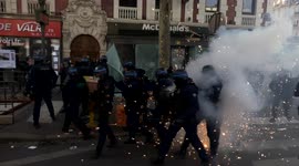 Violence erupts in Paris May Day protests as marchers criticise Macron